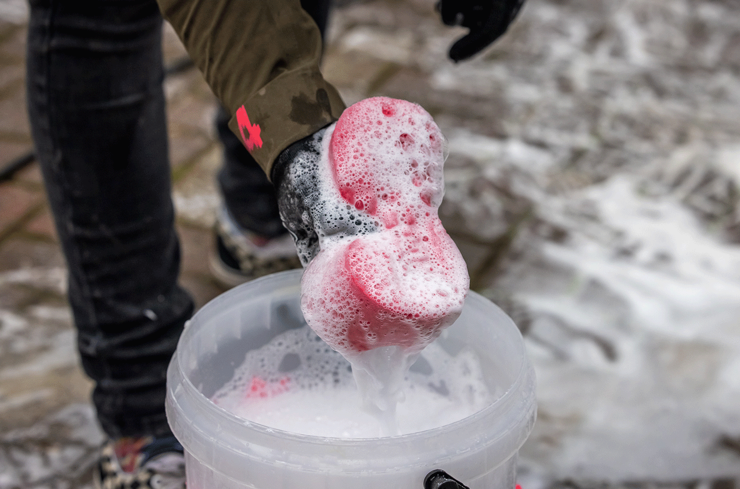 Ringing out Sponge over Dirt Bucket.gif