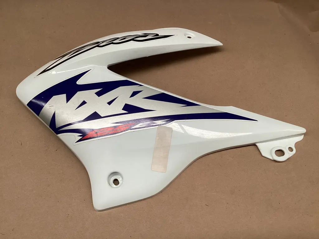 TAPA LATERAL C/CALC.BROS 125 ES BLANCO